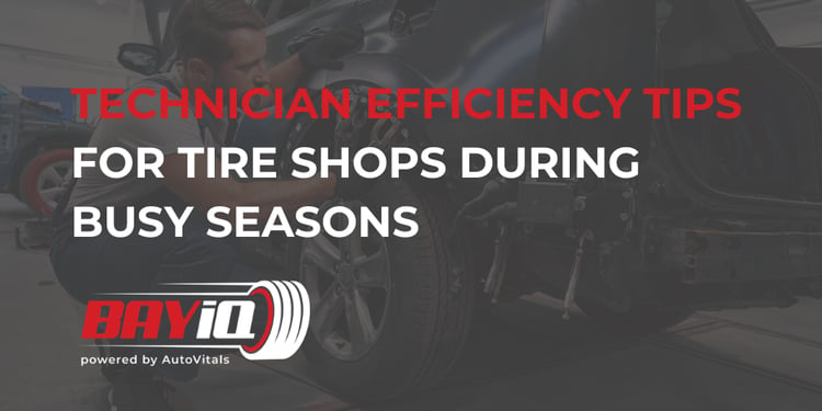 tire shop technician working on vehicle 