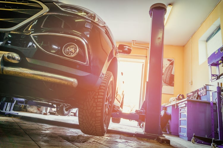 Car in an auto repair shop bay